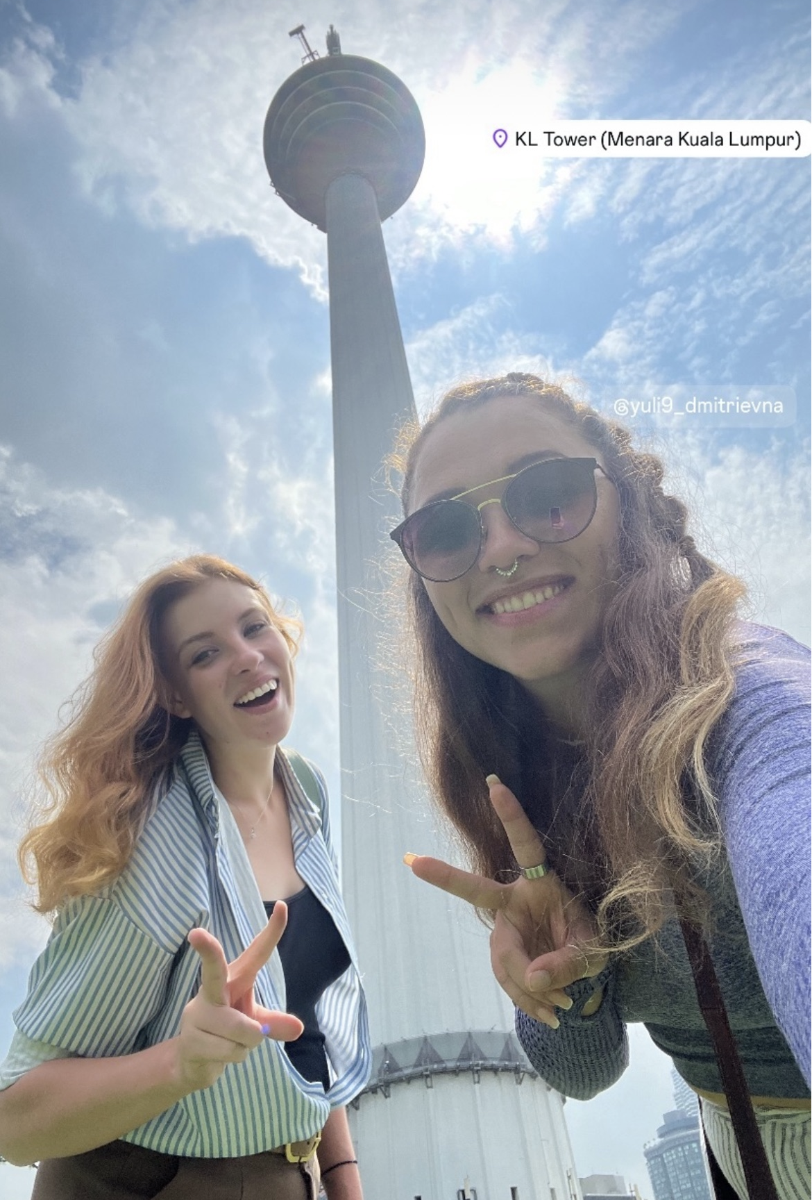 Ksenia and a friend at KL Tower in Kuala Lumpur — a weekend trip outside Vietnam