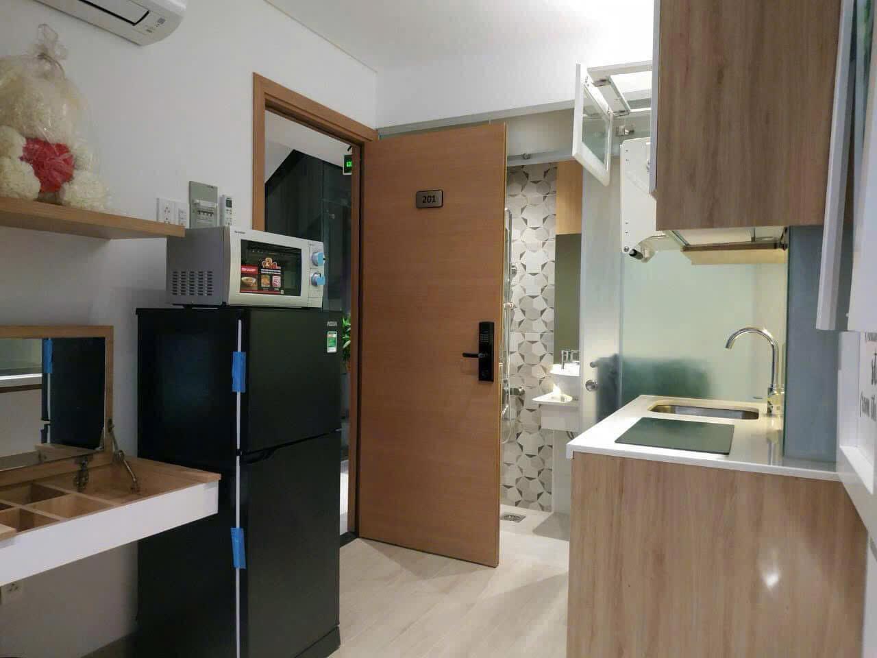 Kitchen and living area in a teacher apartment in District 7 Ho Chi Minh City