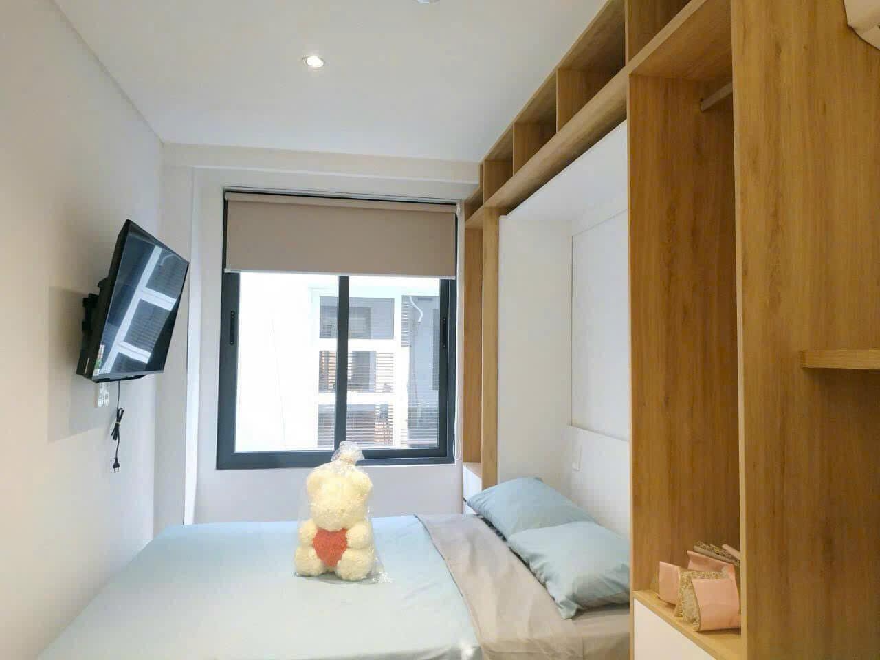 Leila's bedroom in her District 7 apartment — cozy, furnished, $240/month
