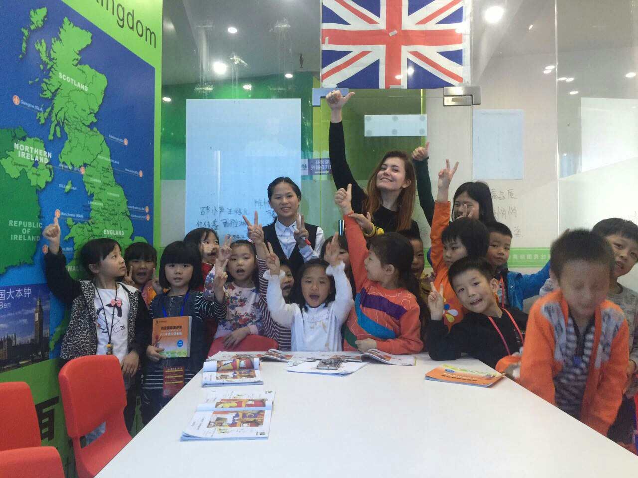 Non-native English teacher with students in Vietnamese classroom