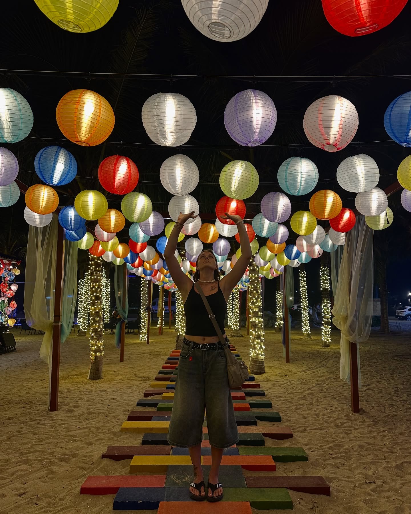 Daria under colourful lanterns at night
